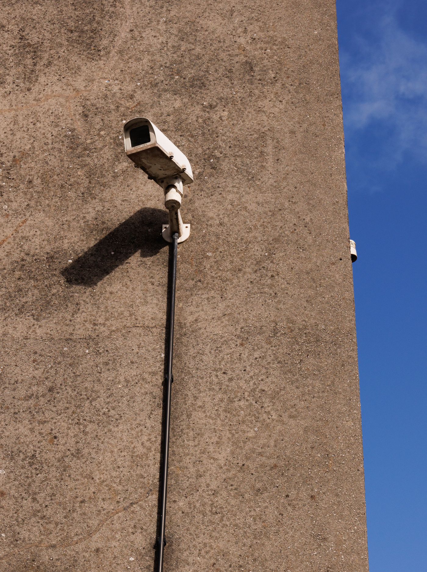 CCTV security camera mounted on a wall