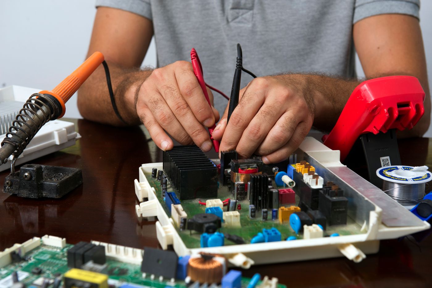 Technician diagnosing an electronic device
