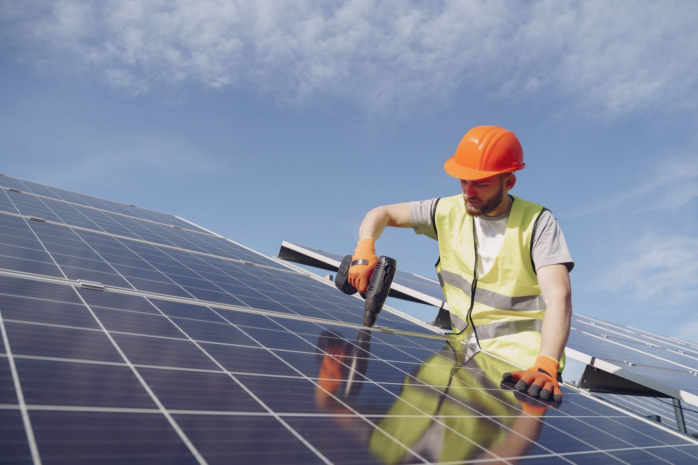 Technician servicing a solar panel